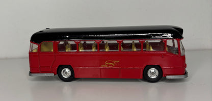 Model bus with a black top and red body on a gray background