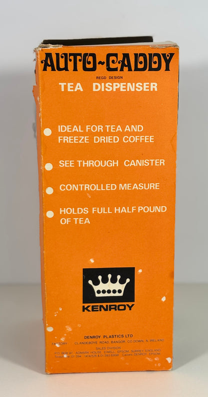 Orange box of an Auto-Caddy tea dispenser with Kenroy branding.