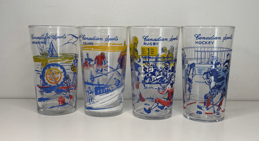 Four glass tumblers with sports-themed illustrations on a white background