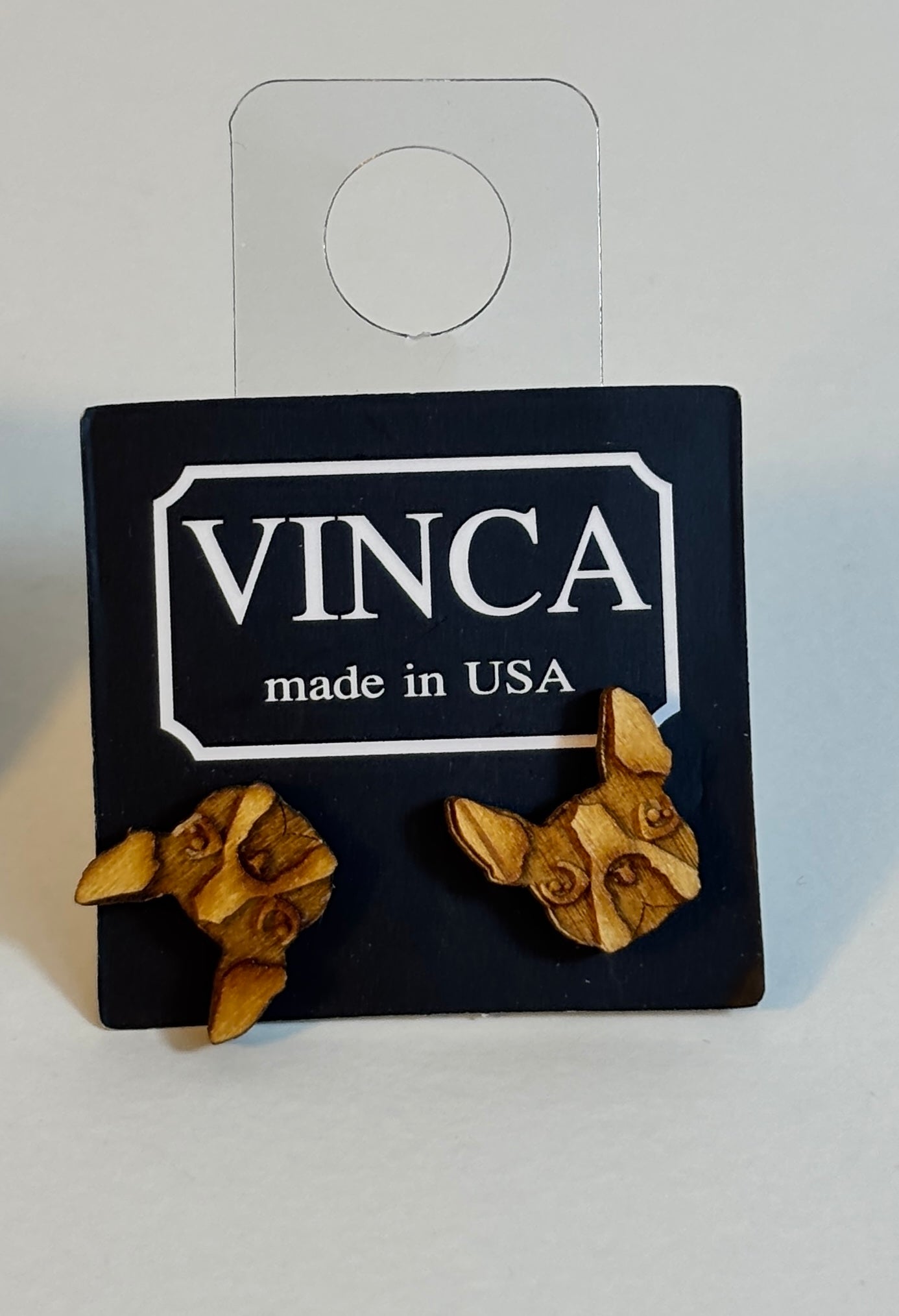 Wooden flower-shaped earrings on a black card with 'VINCA made in USA' branding.