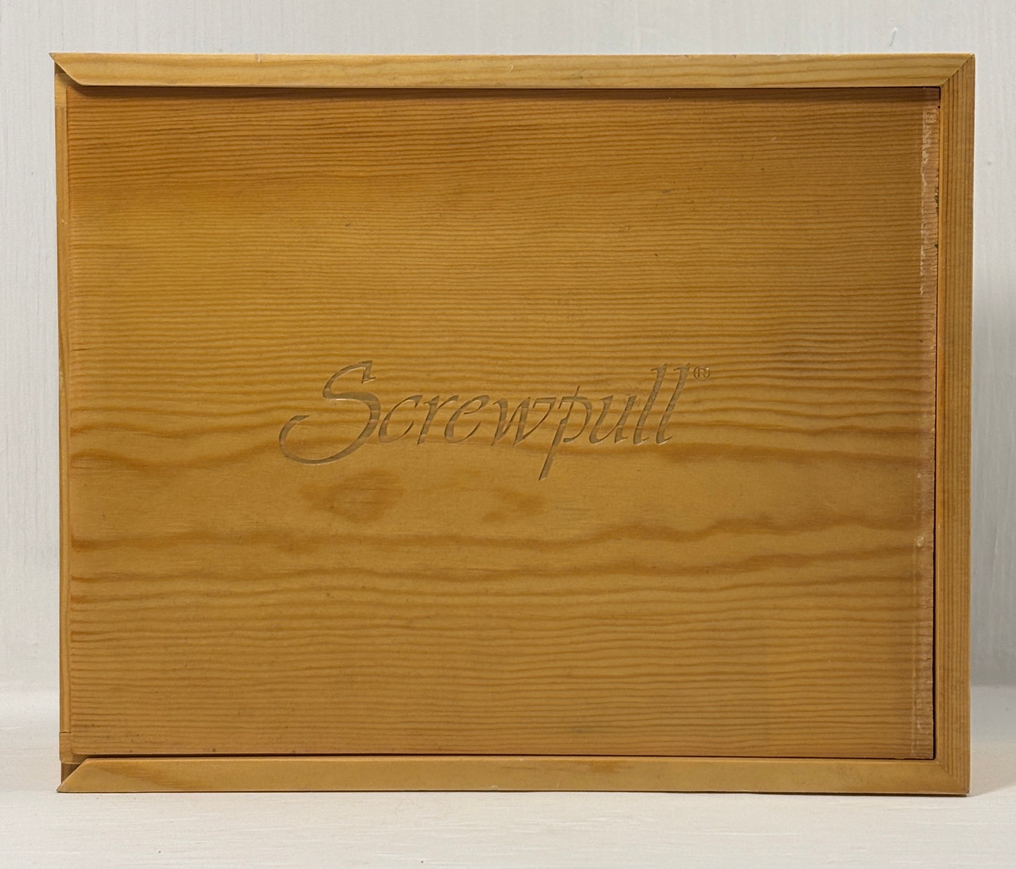 Wooden box with 'Screwpull' branding on a white background