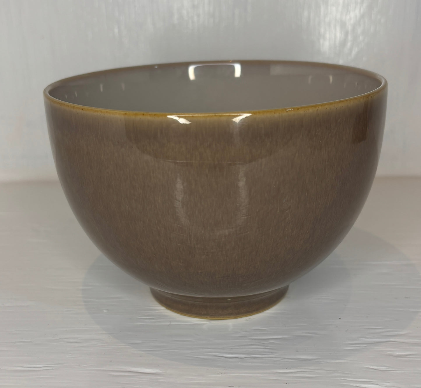 Brown ceramic bowl on a white background