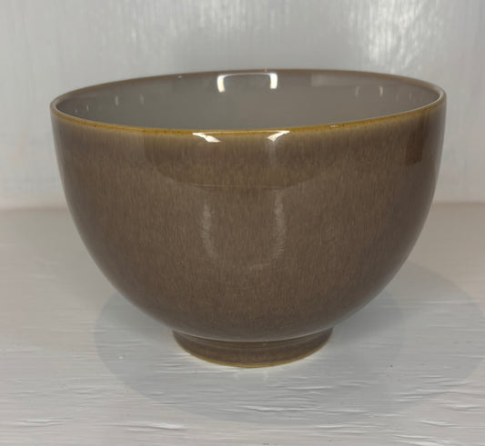 Brown ceramic bowl on a white background