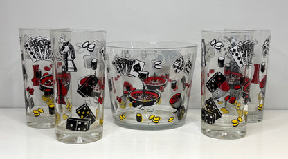 Four glass tumblers with poker-themed designs on a white background