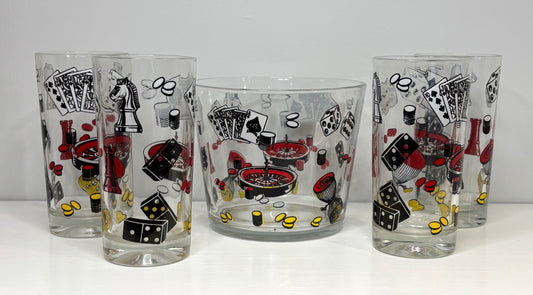 Four glass tumblers with poker-themed designs on a white background