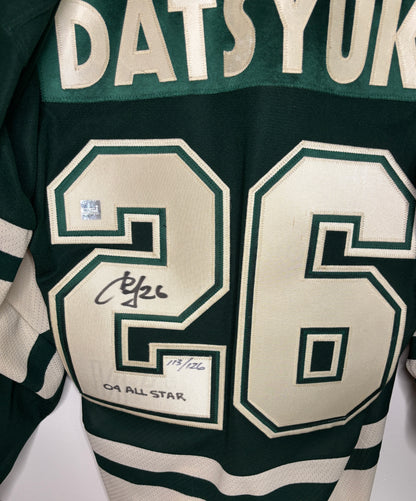 Green sports jersey with number 26 and name 'Datsuyuk' on a white background