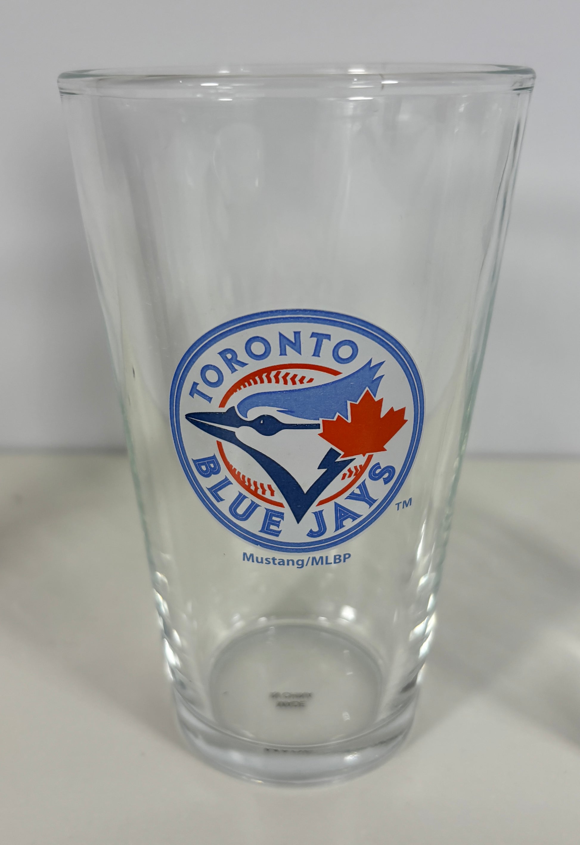 Clear glass with Toronto Blue Jays logo on a white background