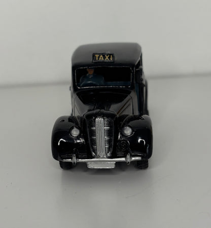 Model of a vintage taxi on a gray background