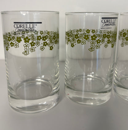 Two clear glasses with floral pattern and Corelle branding on a white background