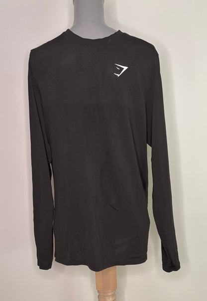 Black long-sleeve shirt with a logo on a mannequin against a white background