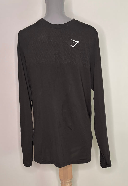 Black long-sleeve shirt with a logo on a mannequin against a white background