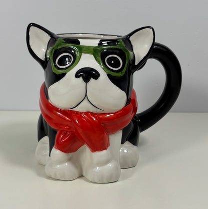 Mug shaped like a dog with goggles and a scarf on a white background