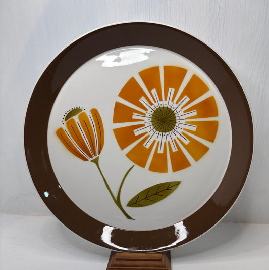 Ceramic plate with floral design on a white background