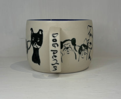 Ceramic mug with dog illustrations and 'Dog Person' text on a white background