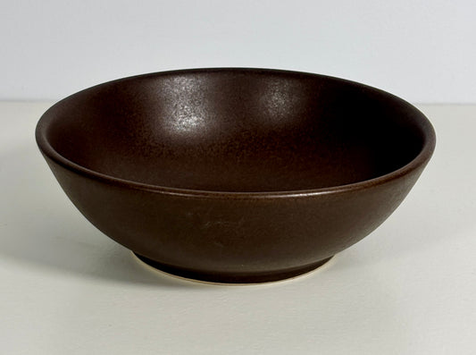 Brown ceramic bowl on a white background