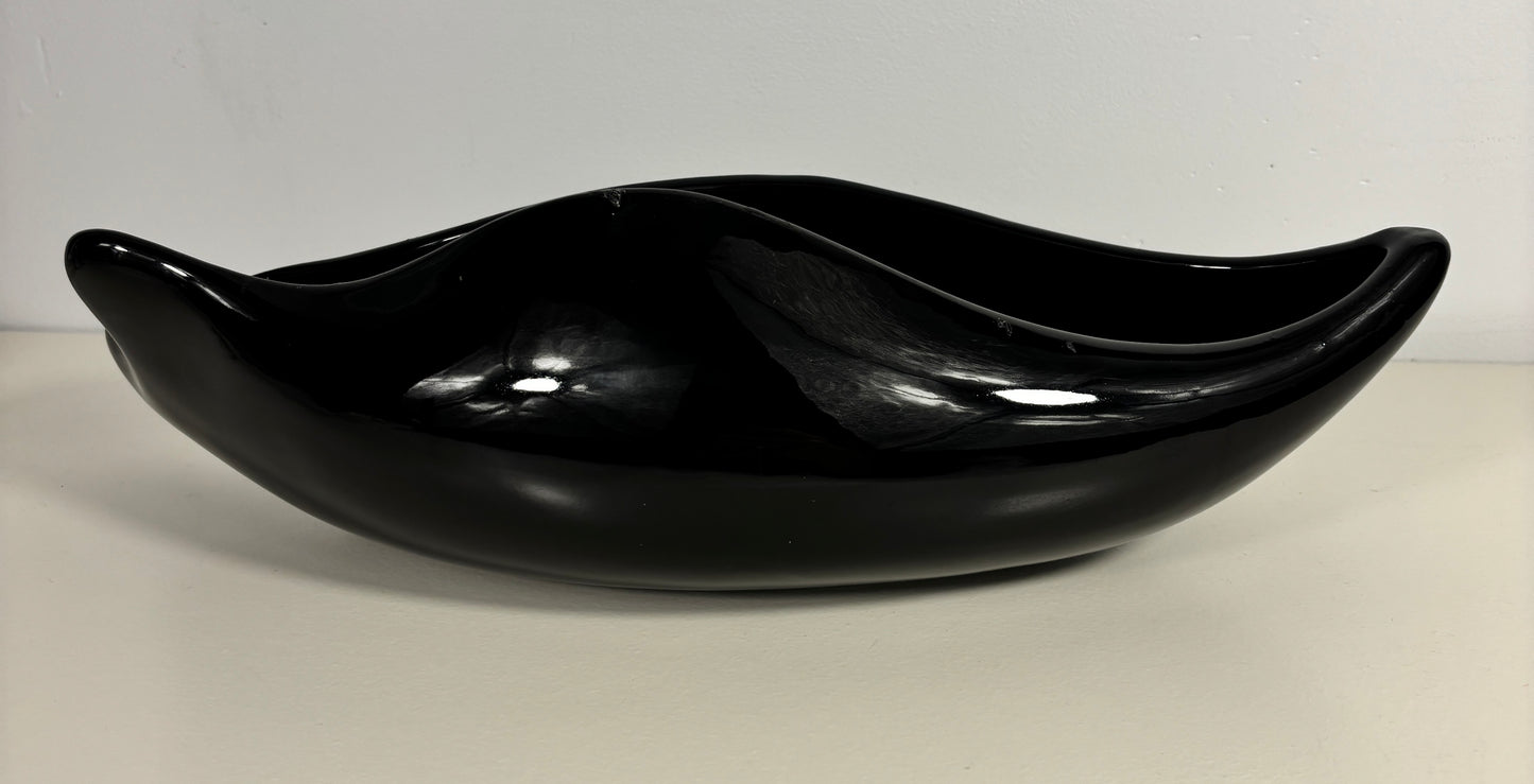 Black ceramic bowl on a white background