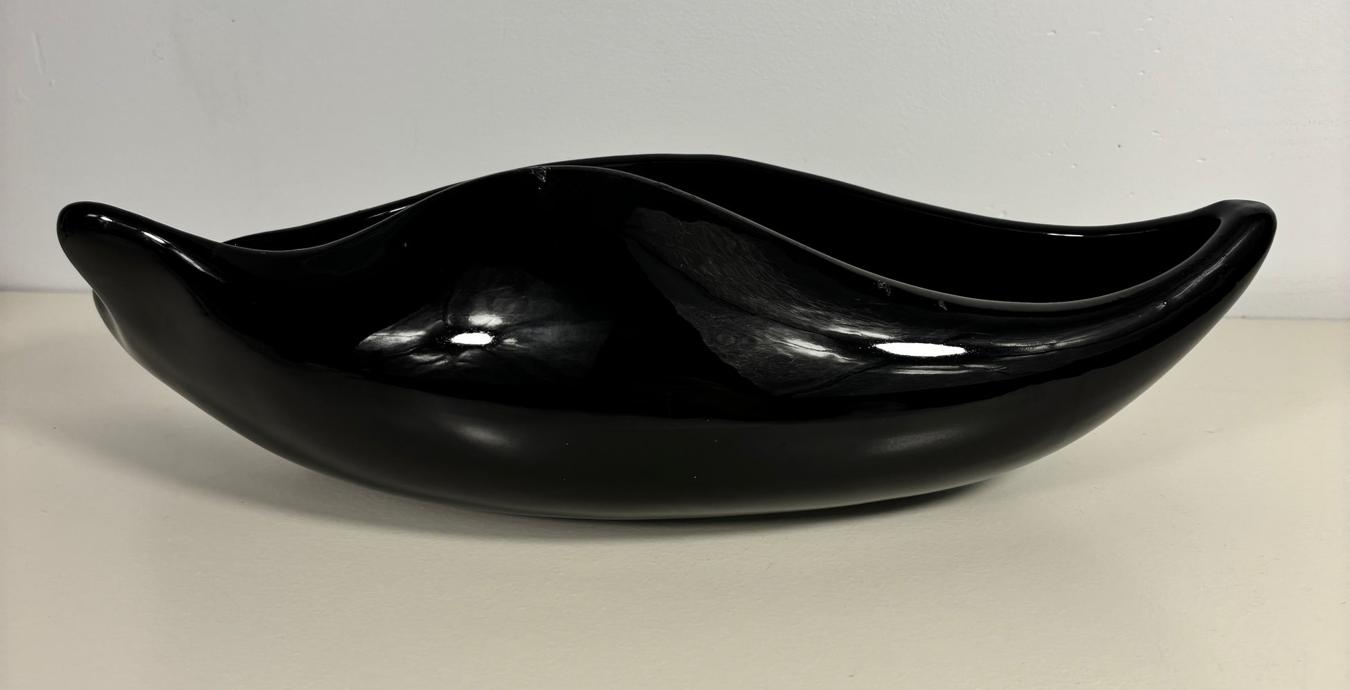 Black ceramic bowl on a white background