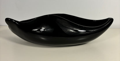 Black ceramic bowl on a white background