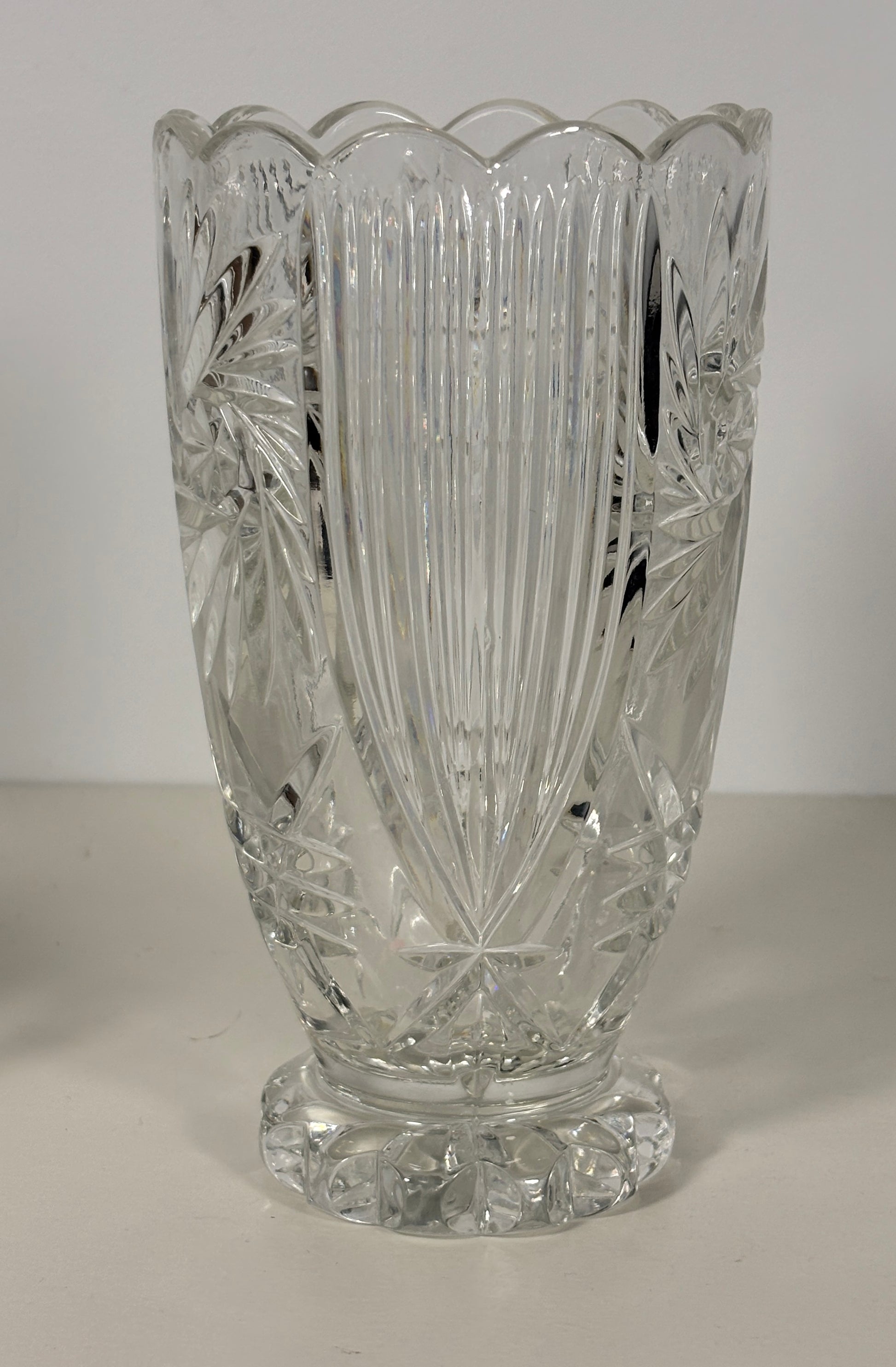 Clear cut glass vase on a white background