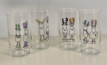 Four glass tumblers with cartoon reindeer designs on a white background