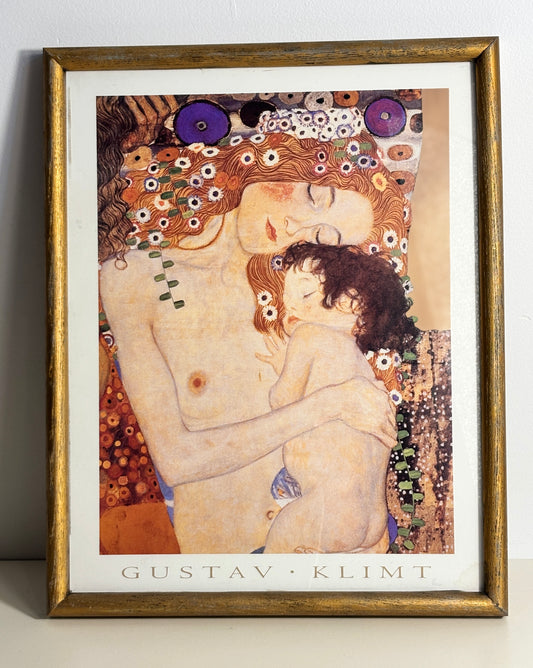 Framed Gustav Klimt artwork on a plain background