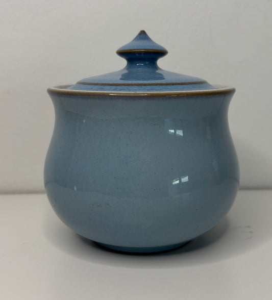 Blue ceramic jar with a lid on a white background