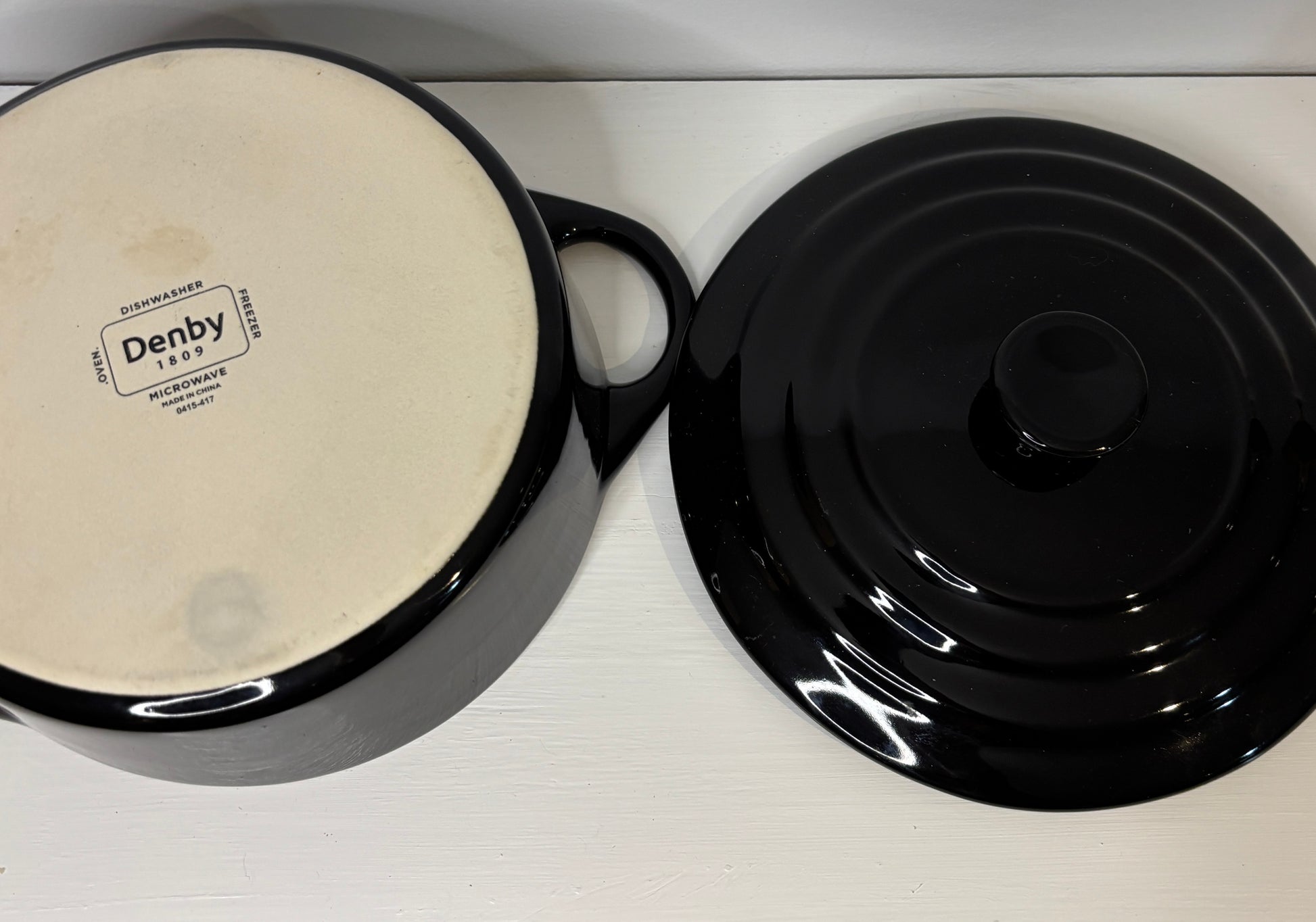 Denby brand ceramic pot with lid on a white surface