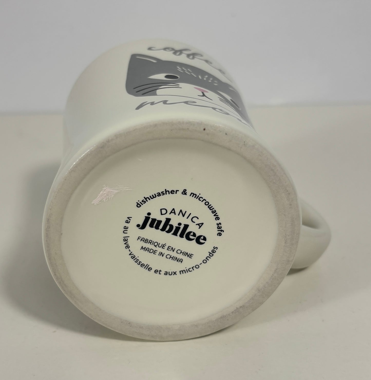 White mug with 'Danica Jubilee' branding on a white background