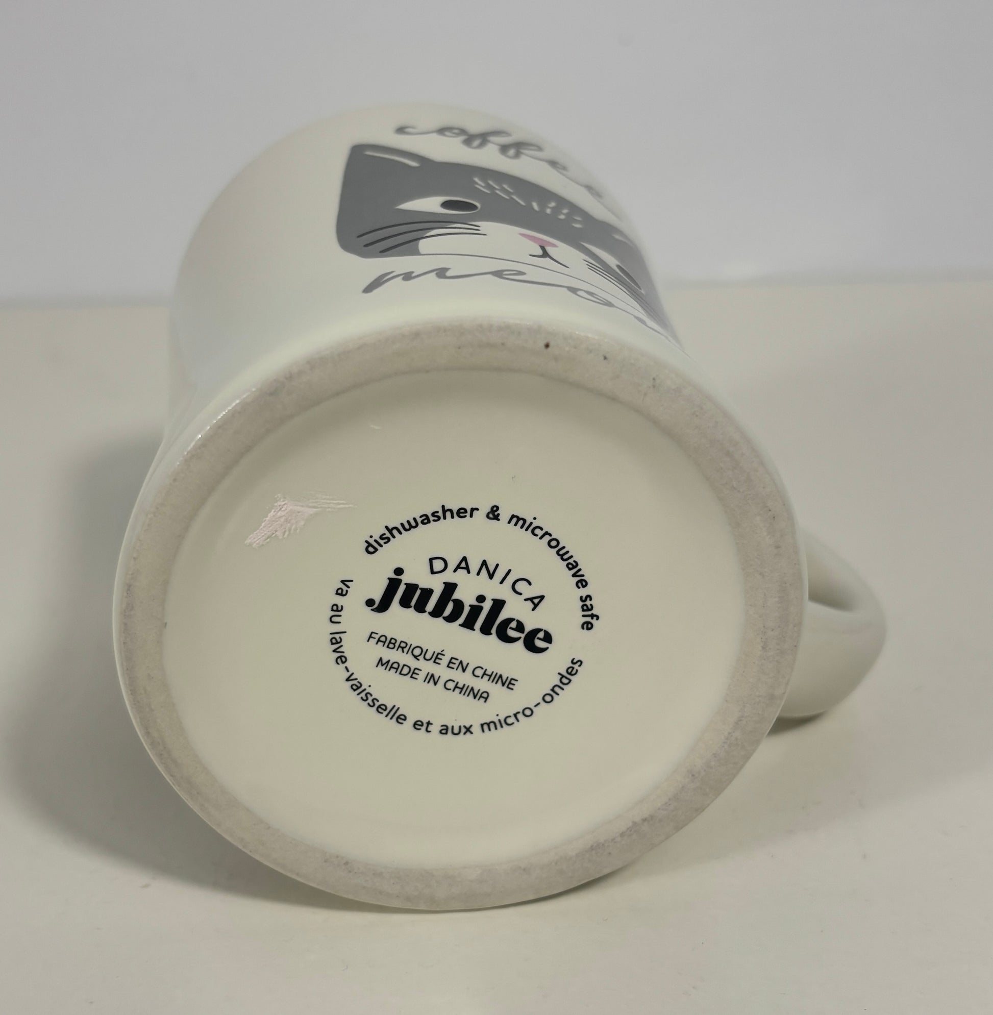 White mug with 'Danica Jubilee' branding on a white background
