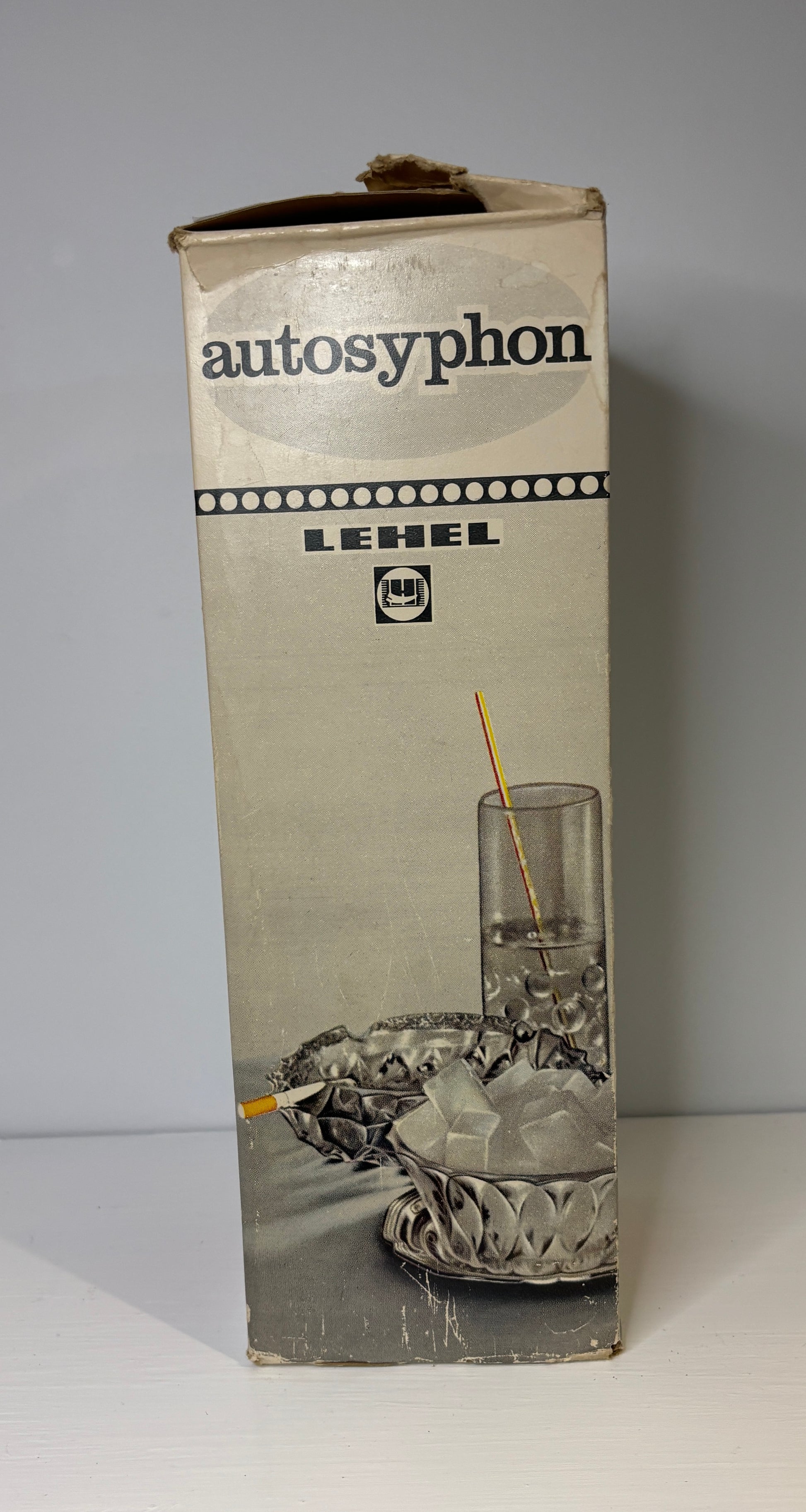 Vintage Lehel Autosyphon packaging with a glass and straw illustration on a gray background