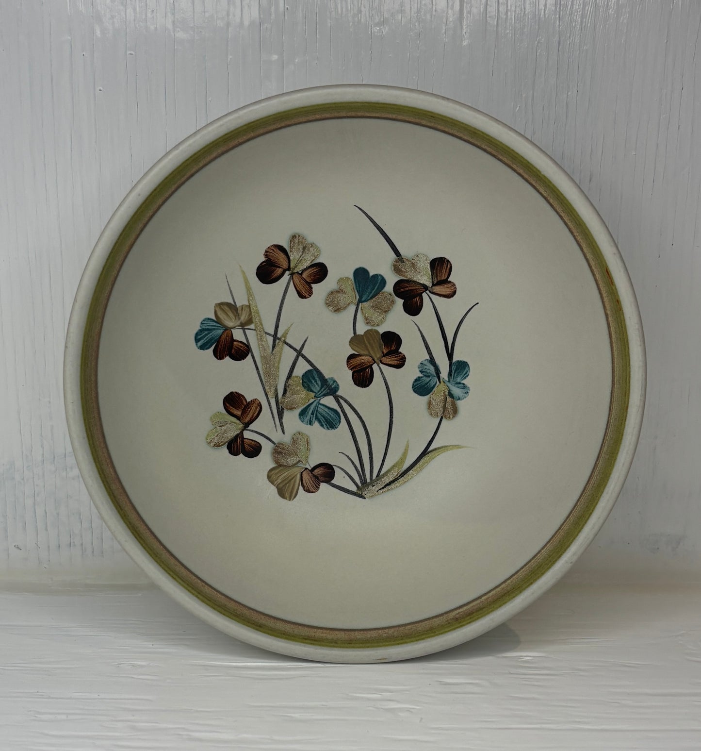 Ceramic plate with floral design on a white background
