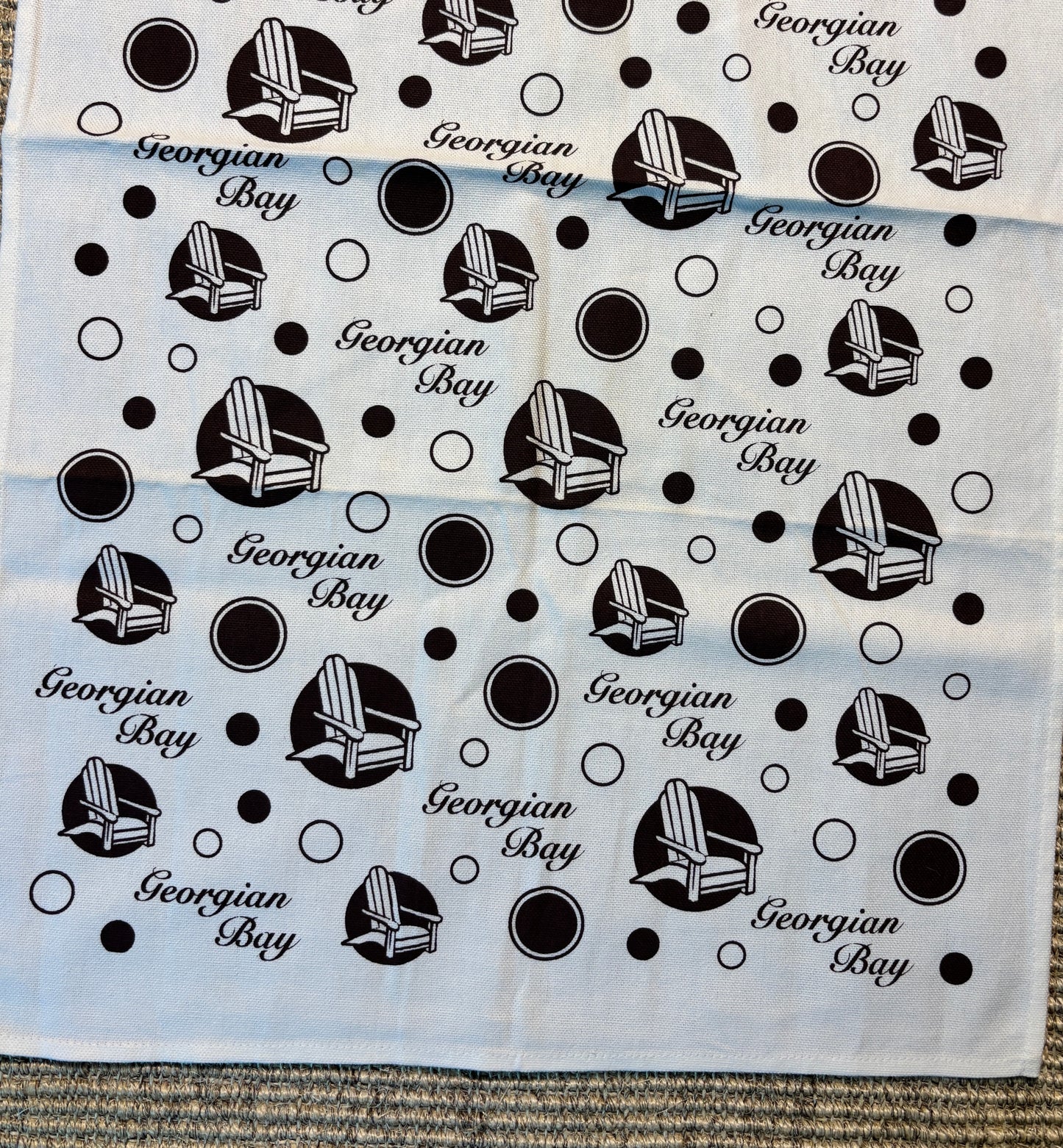 Patterned fabric with Adirondack chair design and 'Georgian Bay' text.