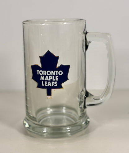 Clear glass mug with Toronto Maple Leafs logo on a white background