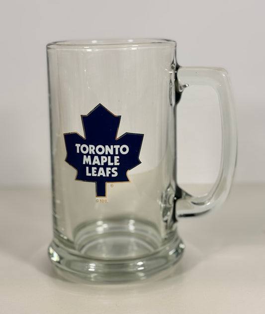 Clear glass mug with Toronto Maple Leafs logo on a white background