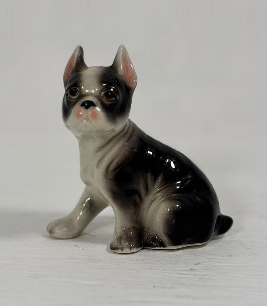 Ceramic figurine of a Boston Terrier on a white background