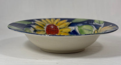 Ceramic bowl with sunflower design on a white background