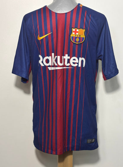 FC Barcelona home soccer jersey by Nike, featuring blue and red vertical stripes, a yellow Nike swoosh, and the FC Barcelona crest on the chest, displayed on a mannequin torso.