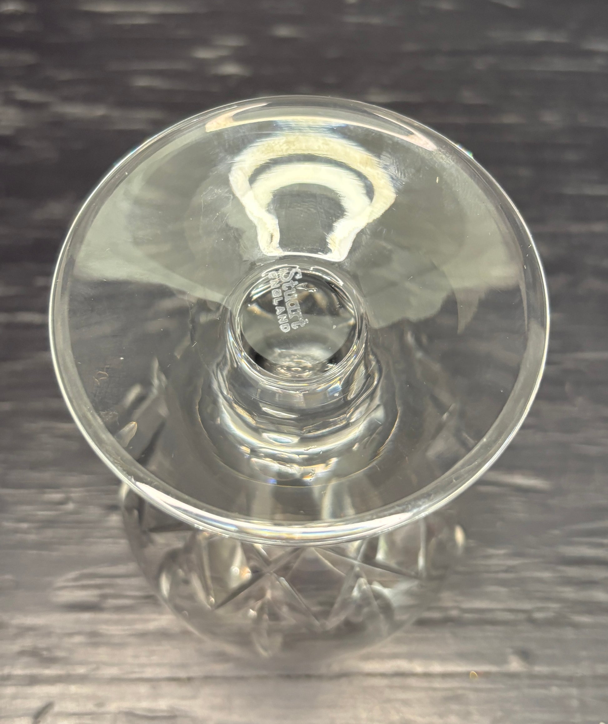 Clear glass stemware on a dark textured surface