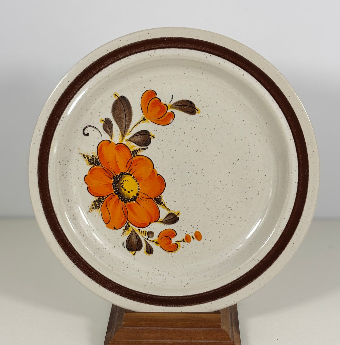 Ceramic plate with floral design on a white background