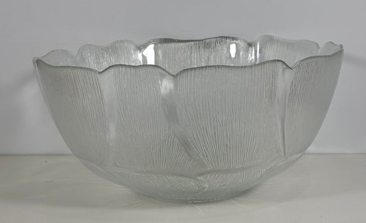 Clear glass bowl with textured surface on a white background