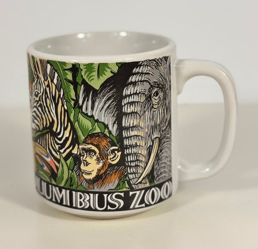 Mug with Columbus Zoo design featuring animals on a white background