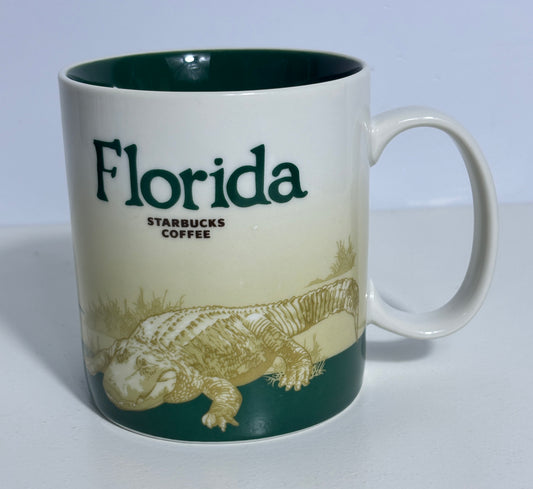 Starbucks Coffee mug with 'Florida' text and alligator illustration on a white background