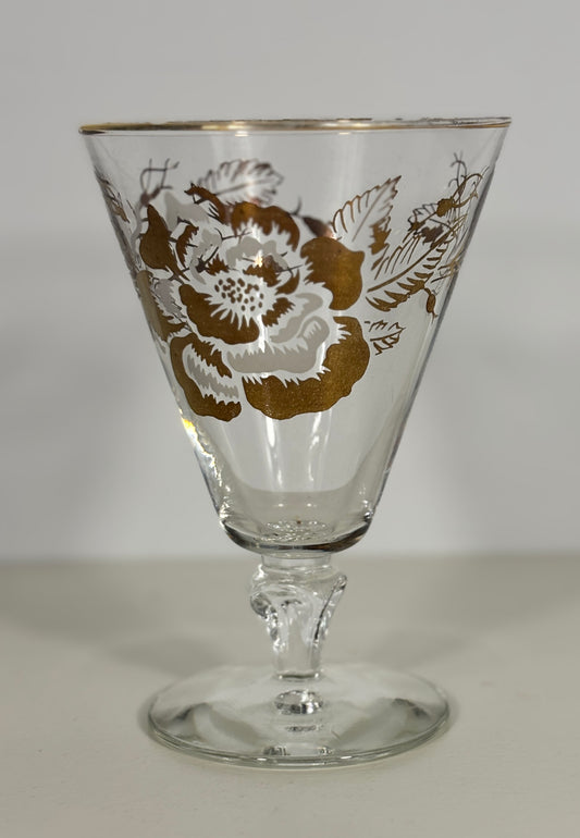 Decorative glass with floral pattern on a plain background