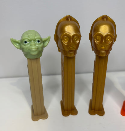Three Star Wars-themed Pez dispensers on a white background