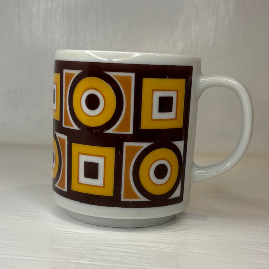 White mug with geometric pattern on a white background