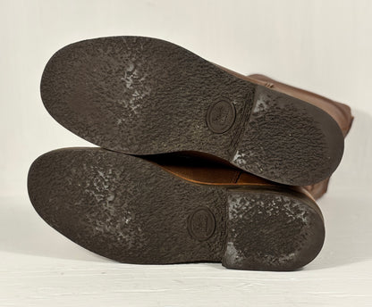 Close-up of brown leather shoes on a light background