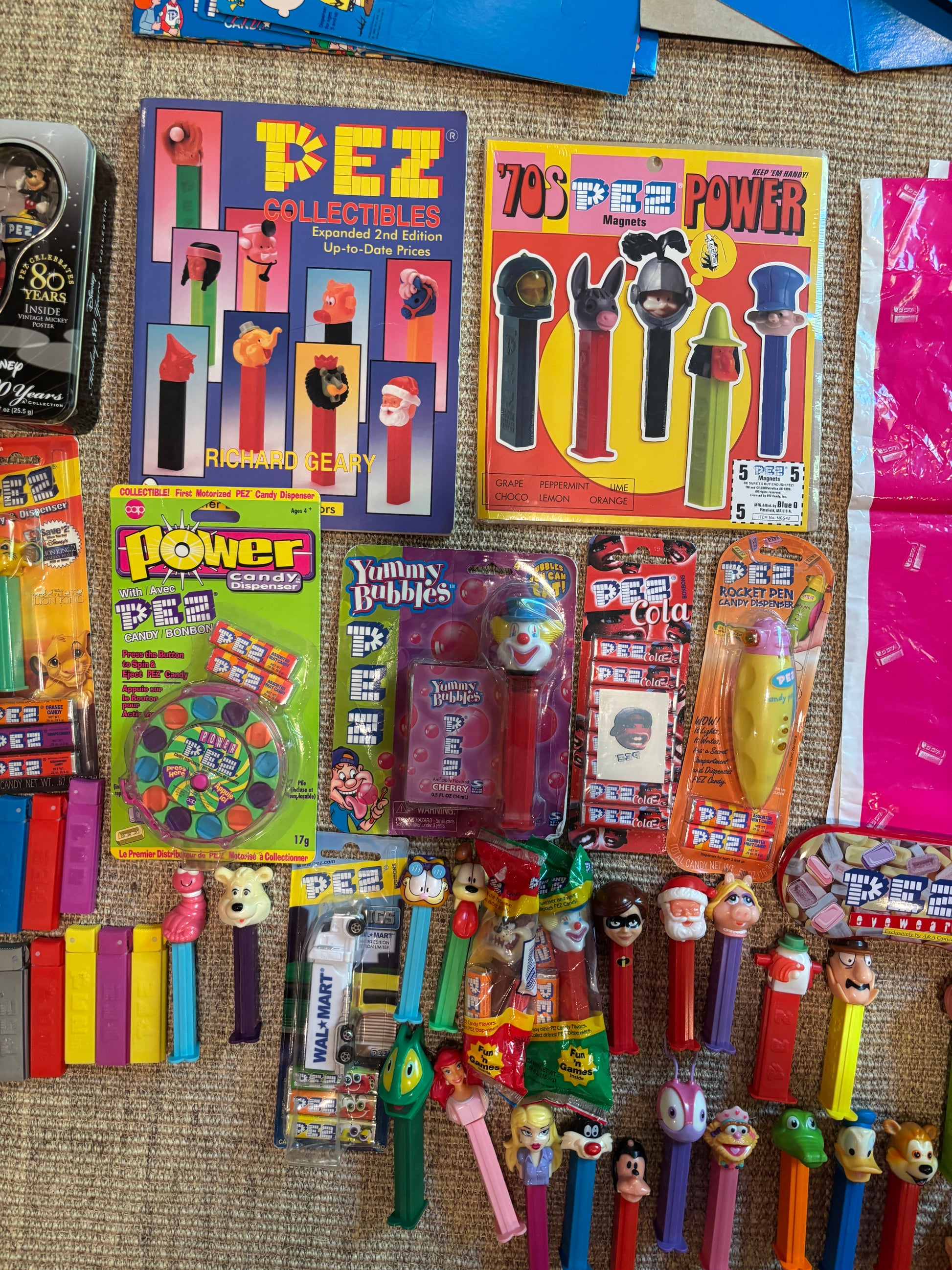 Collection of vintage toys and packaging on a textured surface