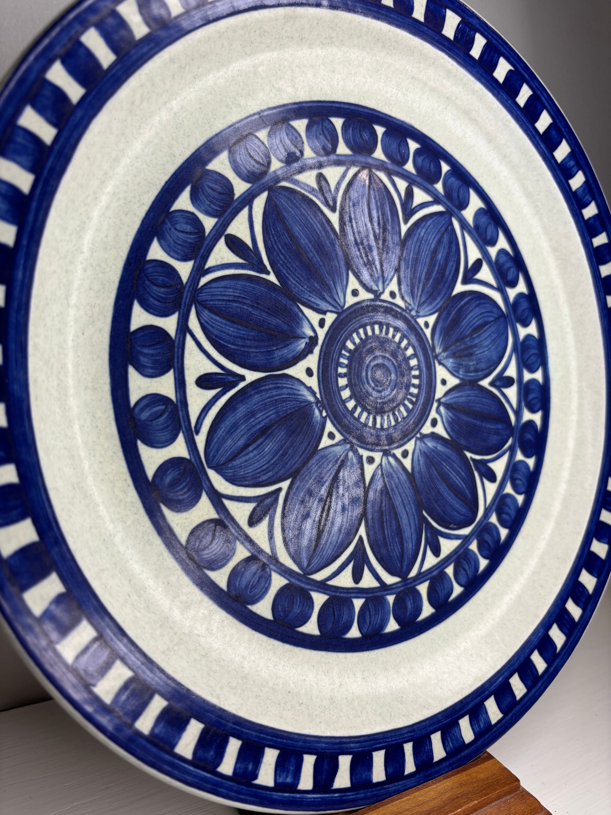 Ceramic plate with blue floral design on a white background