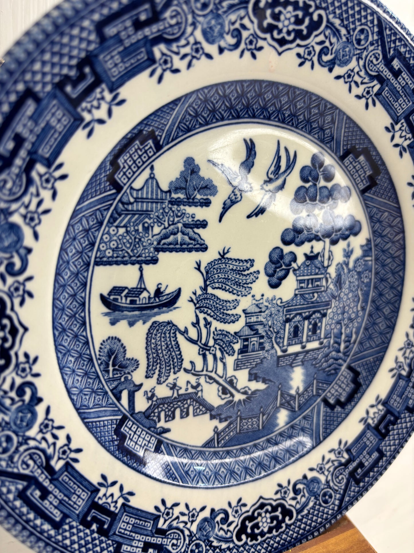 Blue and white ceramic plate with intricate patterns