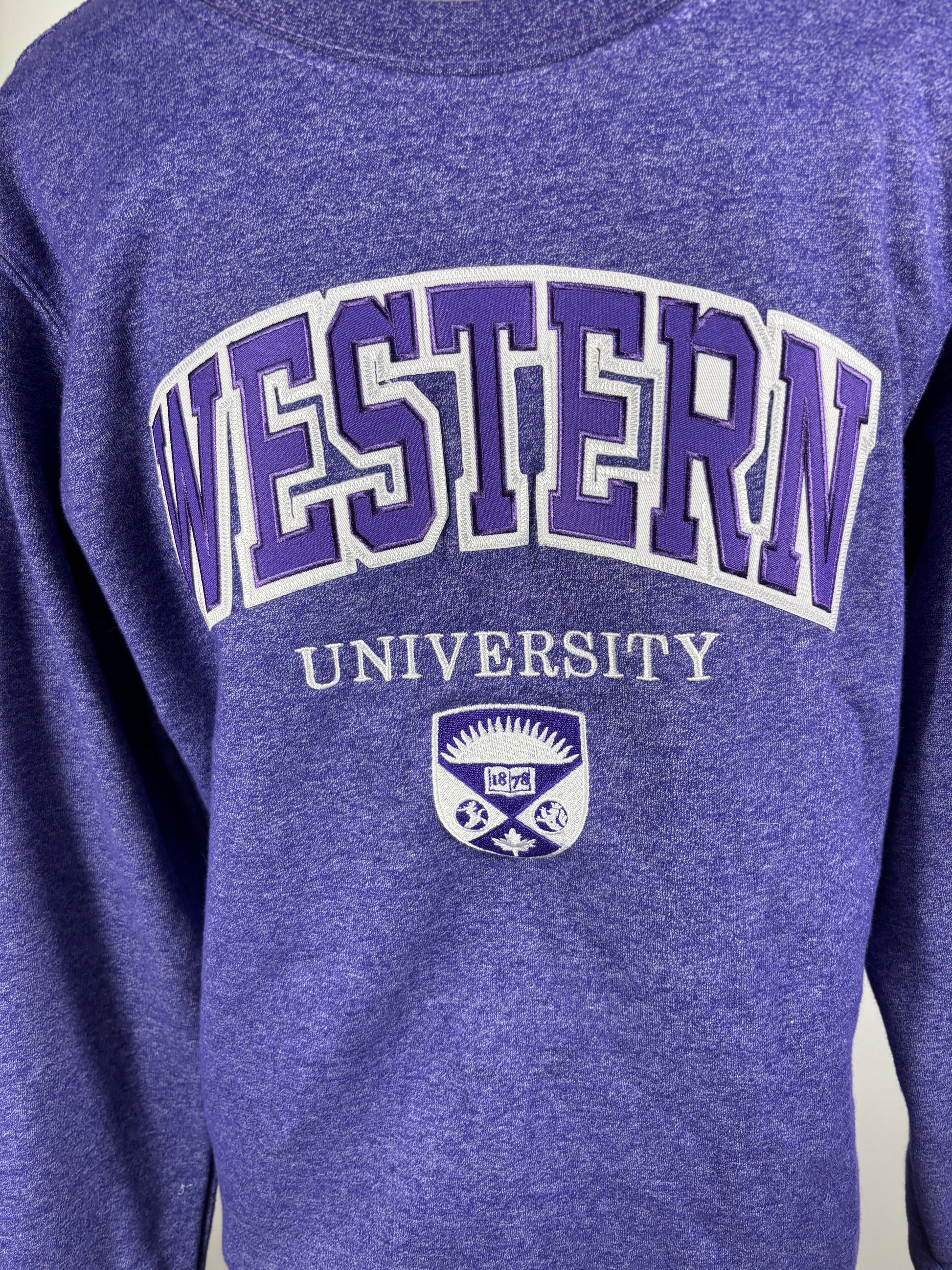 Purple sweatshirt with 'Western University' text and logo